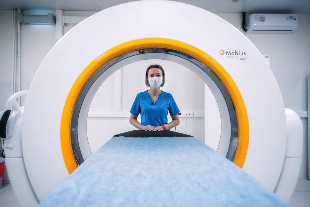 staff nurse jobs in the UK - nurse with MRI machine in hospital