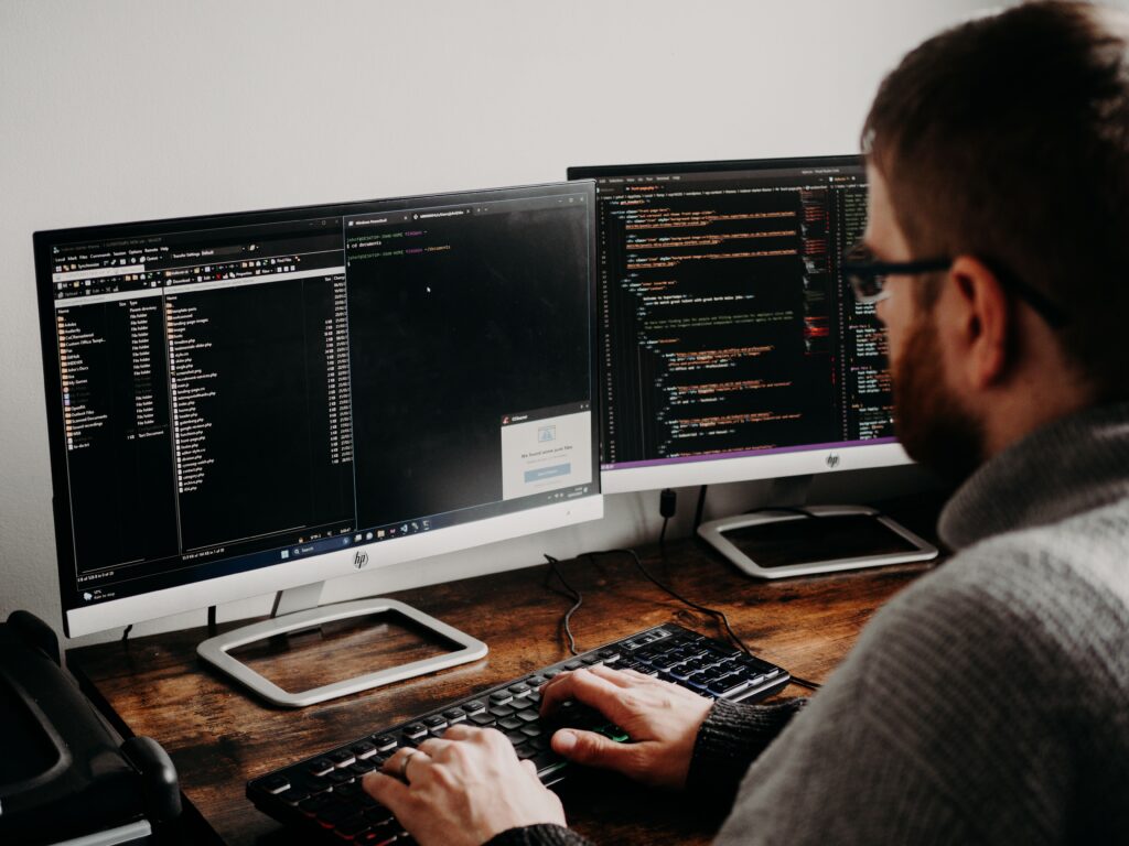 software development engineer jobs in Seattle - programmer coding on dual monitors