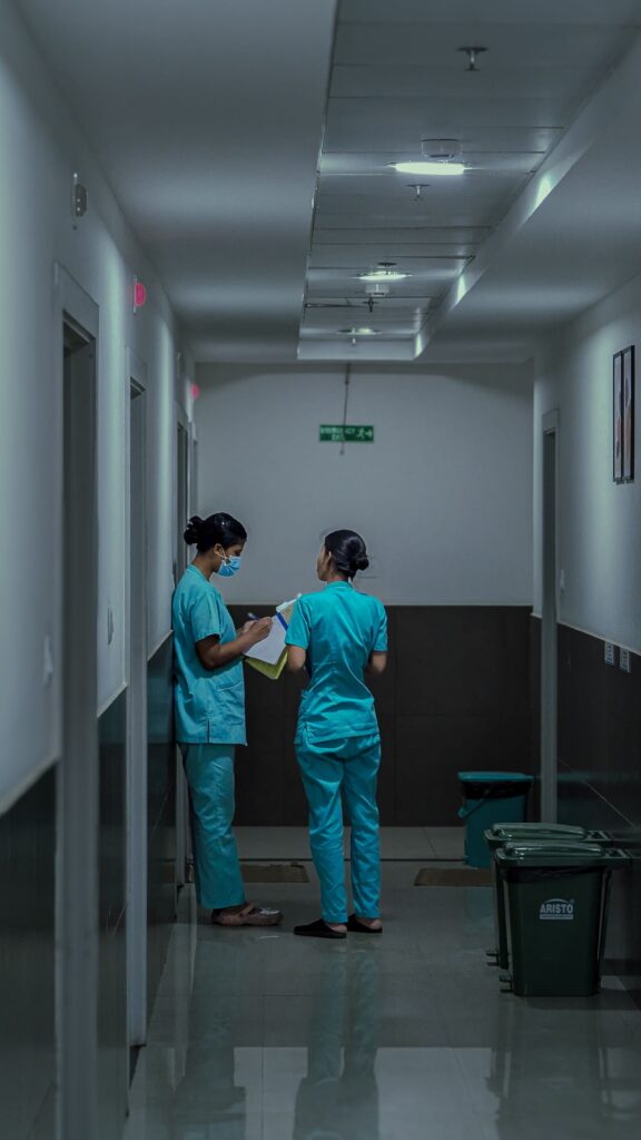 staff nurse jobs in Salford with visa sponsorship - nurses in hospital corridor