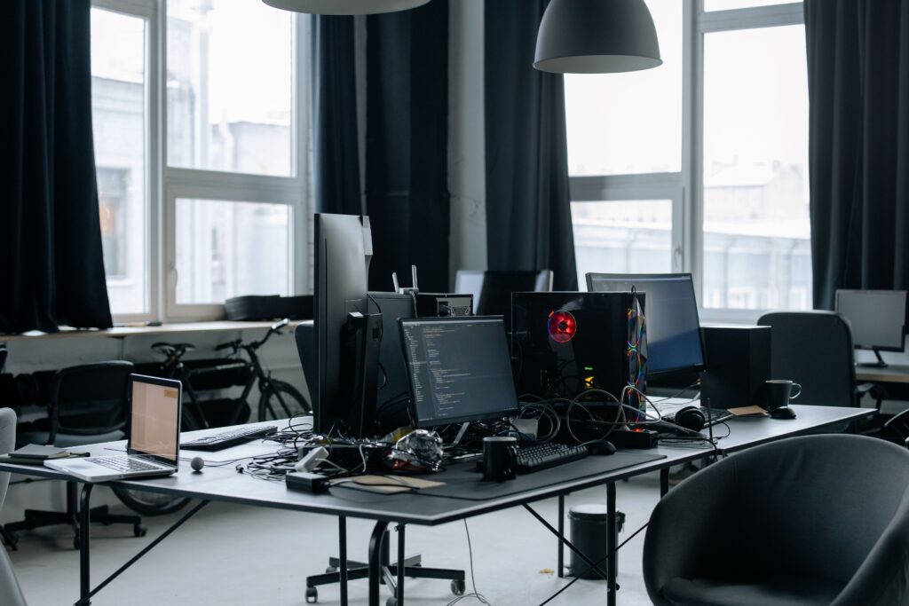 Senior software engineer jobs in Redmond USA - contemporary workspace with computers and coding screens